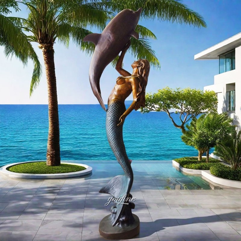 bronze dolphin and mermaid