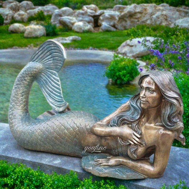 bronze lying mermaid