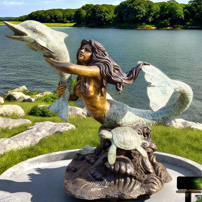 swimming mermaid statue