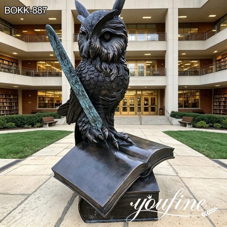 bronze owl sculpture in square